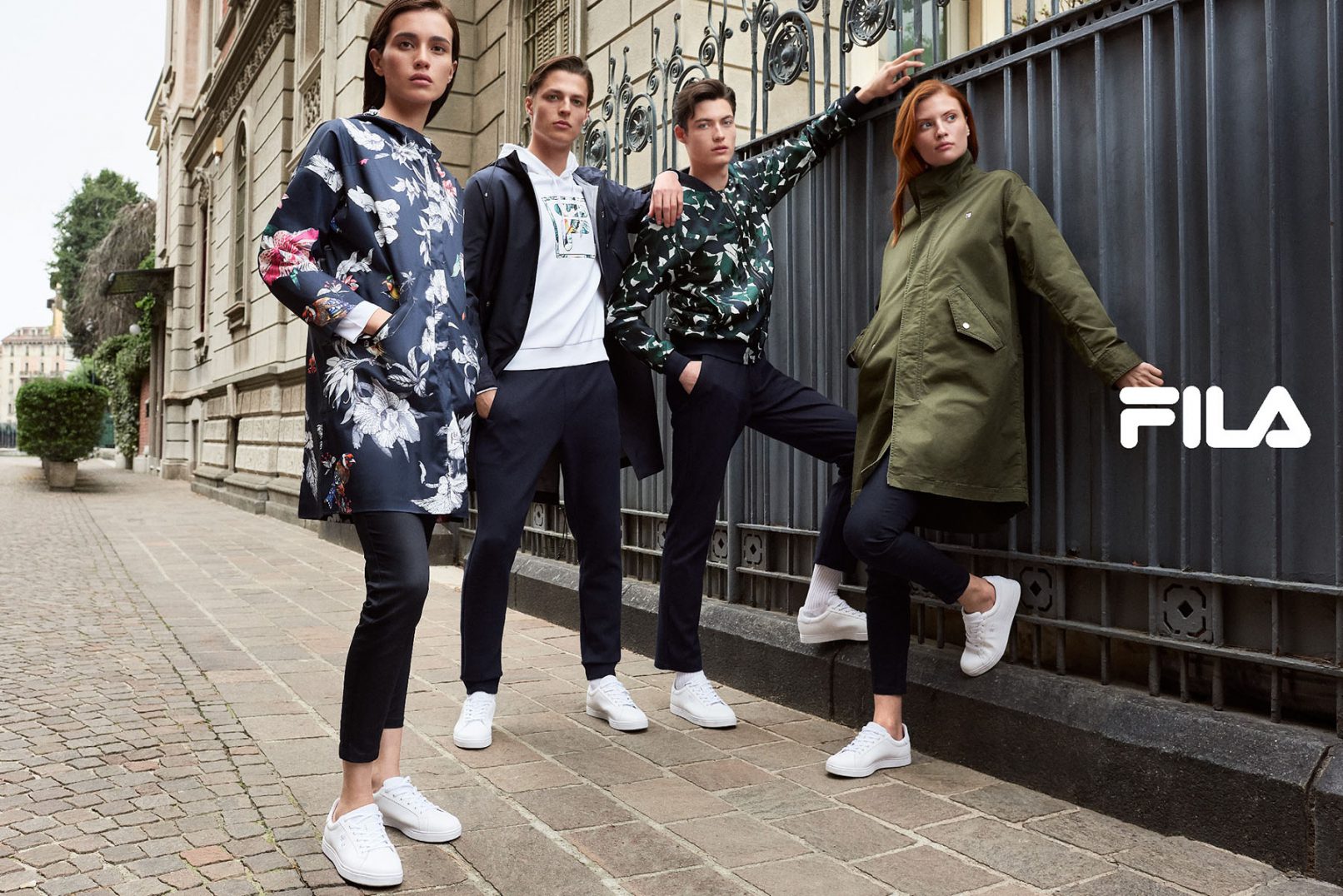 Fila Cina AW 2018 Advertising image shot in Milan by portrait, advertising and commercial photographer David Umberto Zappa. Talents posing in front of a fence in downtown Milan. Immagine pubblicitaria scattata da David Umberto Zappa, fotografo commerciale, pubblicitario, editoriale, a Milano.